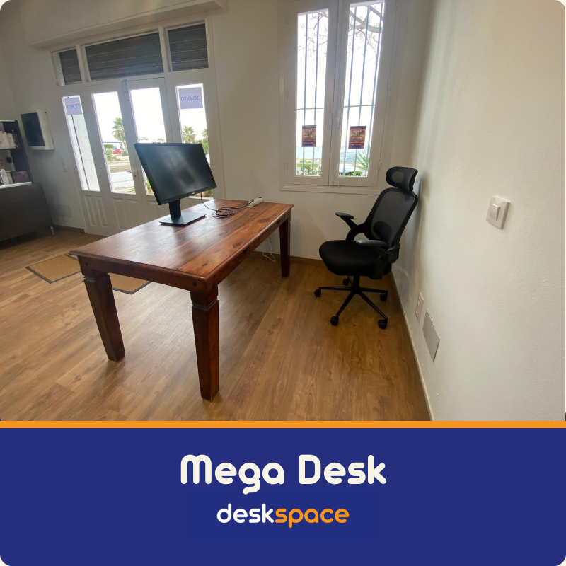 Large desk in the corner of the DeskSpace Coworking in Mojacar.
