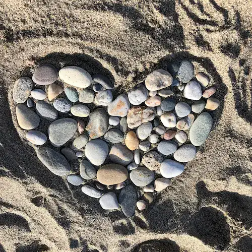 Stones in the shape of a heart on a beach in Mojácar
