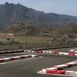 From the viewing platform at Karting Garrucha near Mojacar - a place for Go Carting. Looking at the track with some hills in the distance.