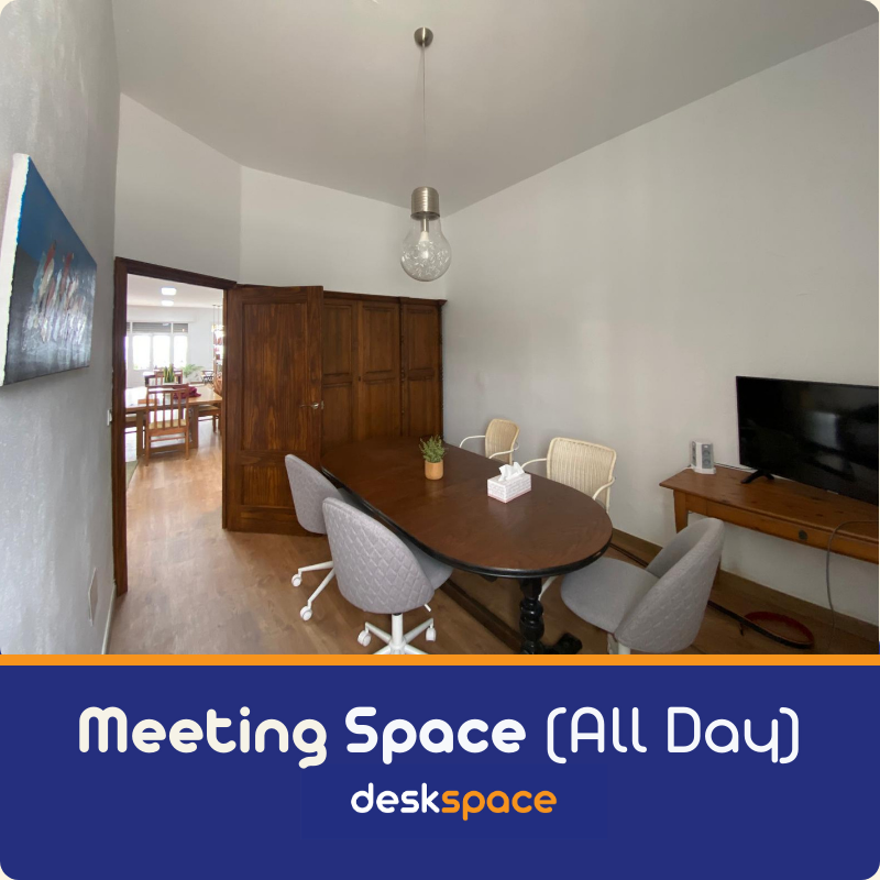 Meeting Space in Mojacar - All Day. Showing the room with a central table and chairs.